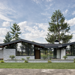 Wide-angle view of the Mid-century Modern home’s living room, showcasing its connection to the outdoors through large windows and sliding glass doors that offer scenic views.
